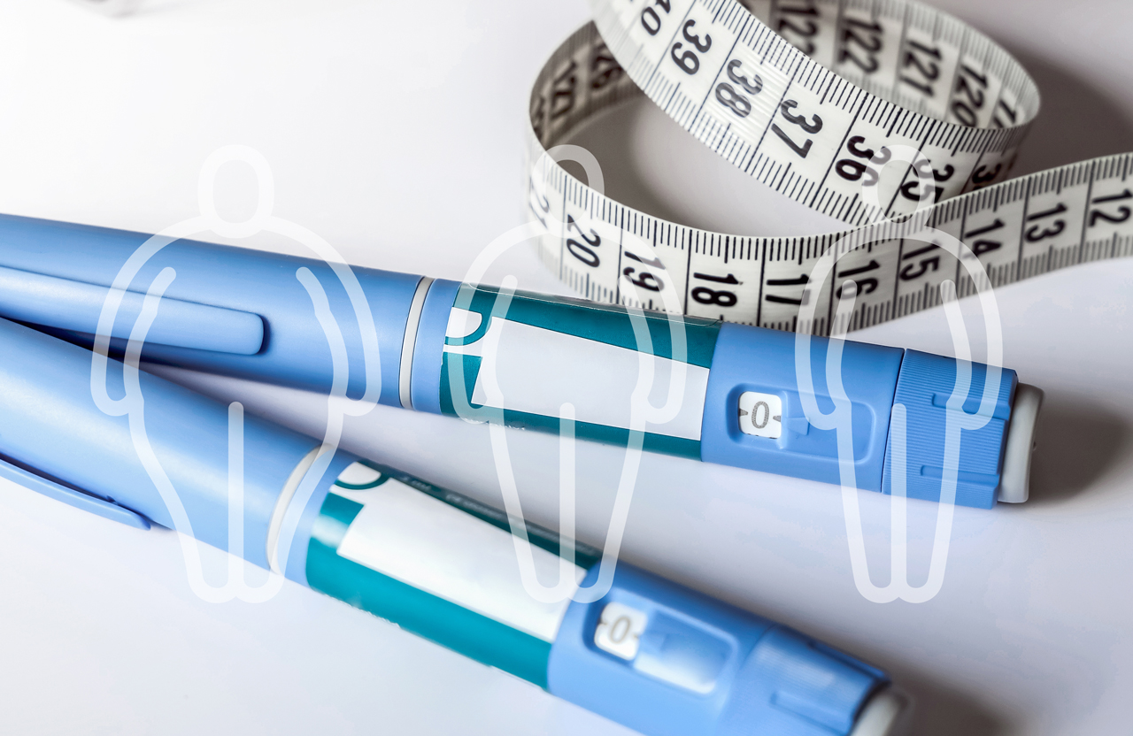Medical injector pens, measuring tape, and weight loss graphic