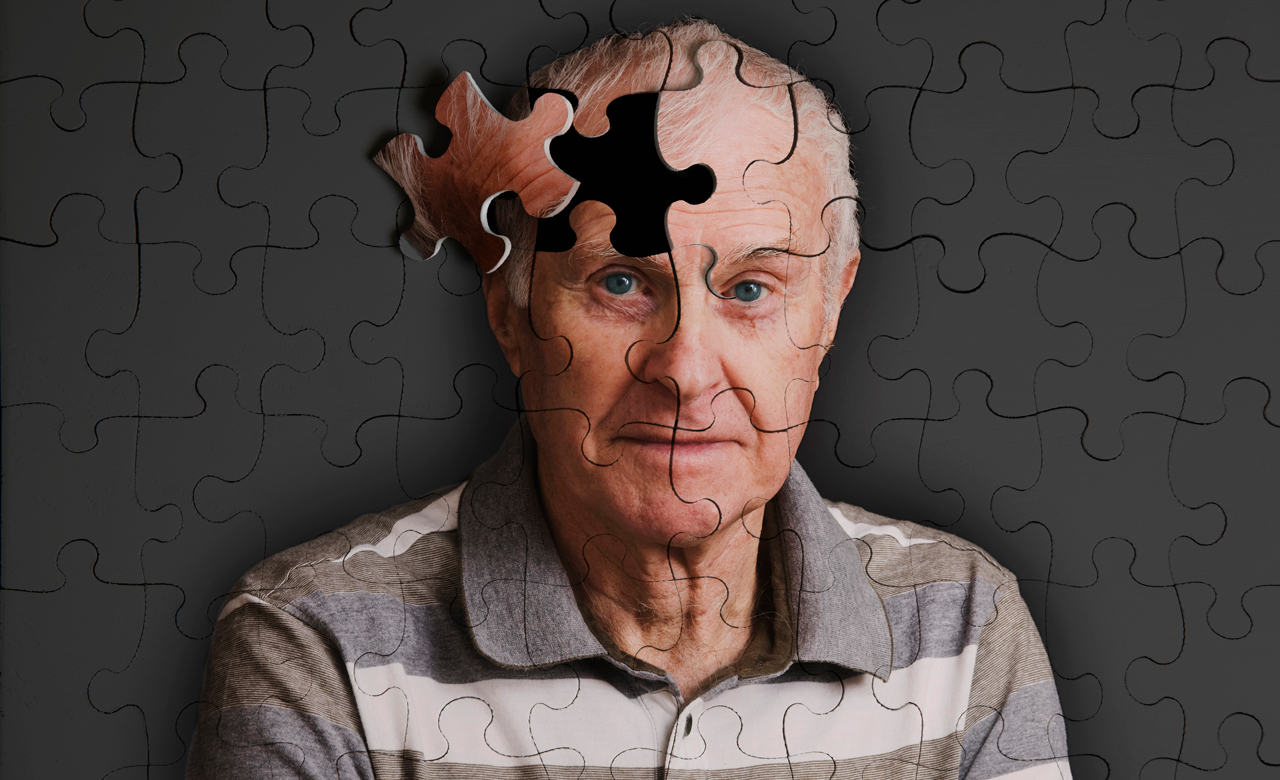 Portrait of an eldery man composed of jigsaw puzzle pieces with some pieces missing.