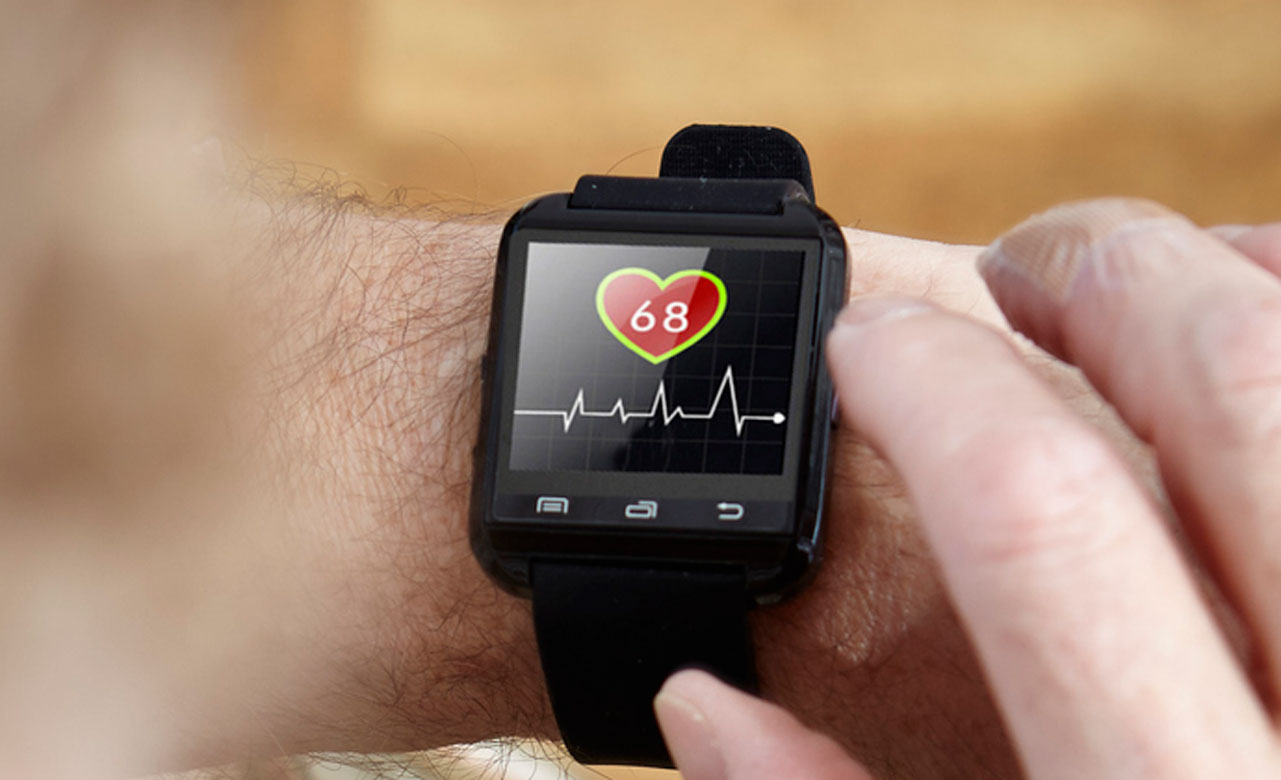Patient enabling a Smart Watch on their wrist.