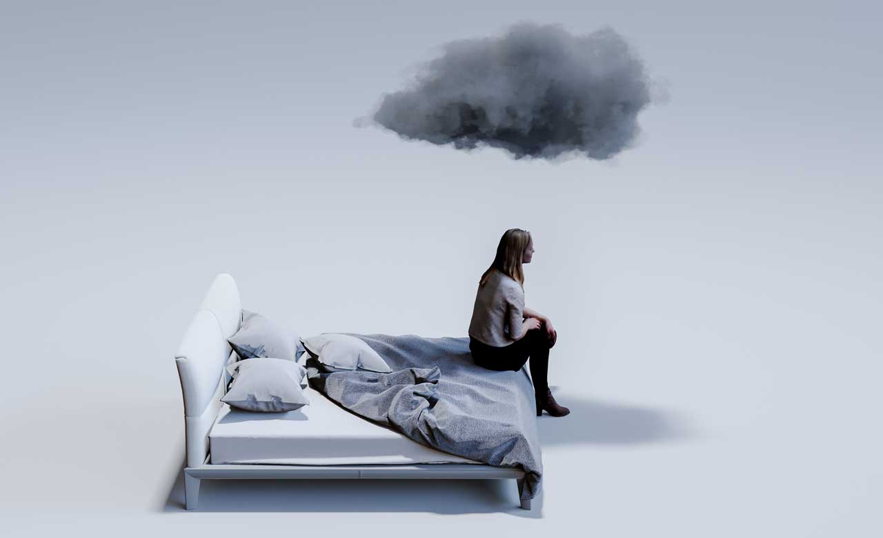 Photoillustration of woman sitting on bed with gray storm cloud hanging over her head. 