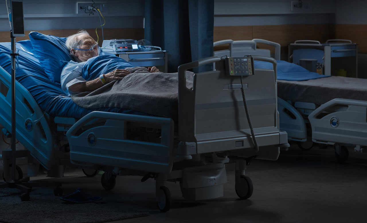 Image of a man in hospital bed