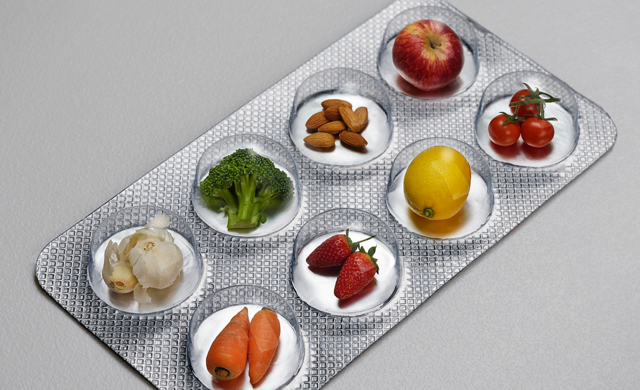 Photo illustration of fruits and vegetables presented in a blister-pack